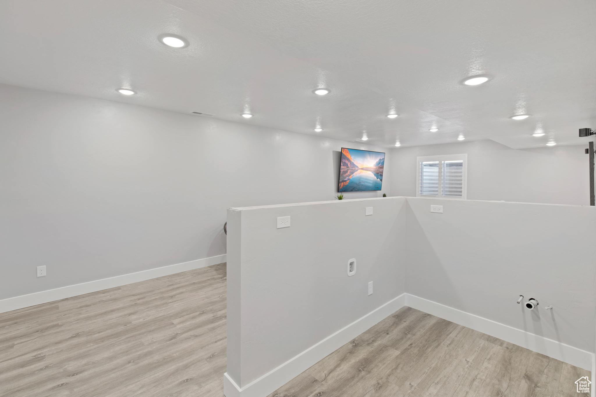 Interior space with light hardwood / wood-style flooring