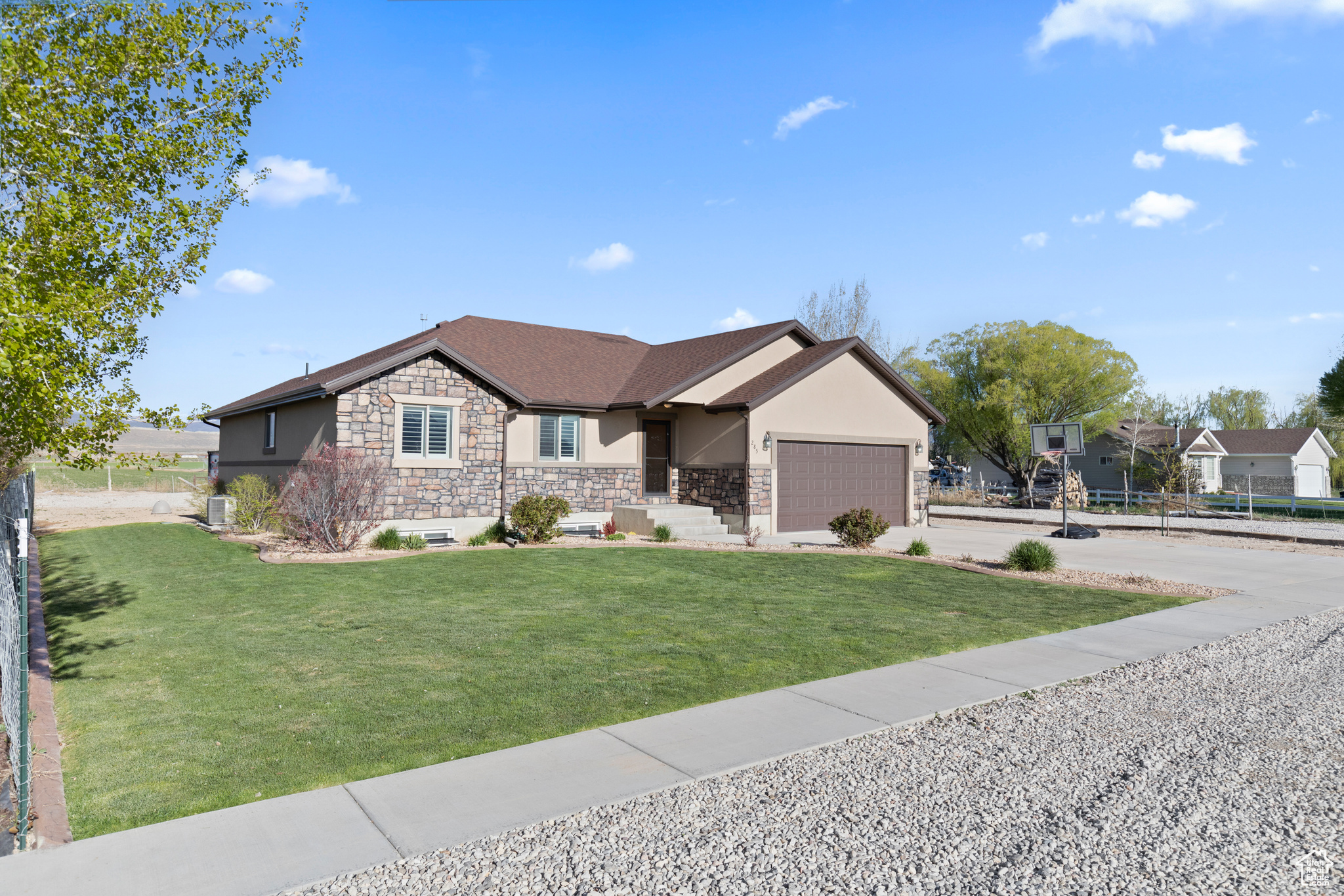 View of front facade with a garage and a front yard