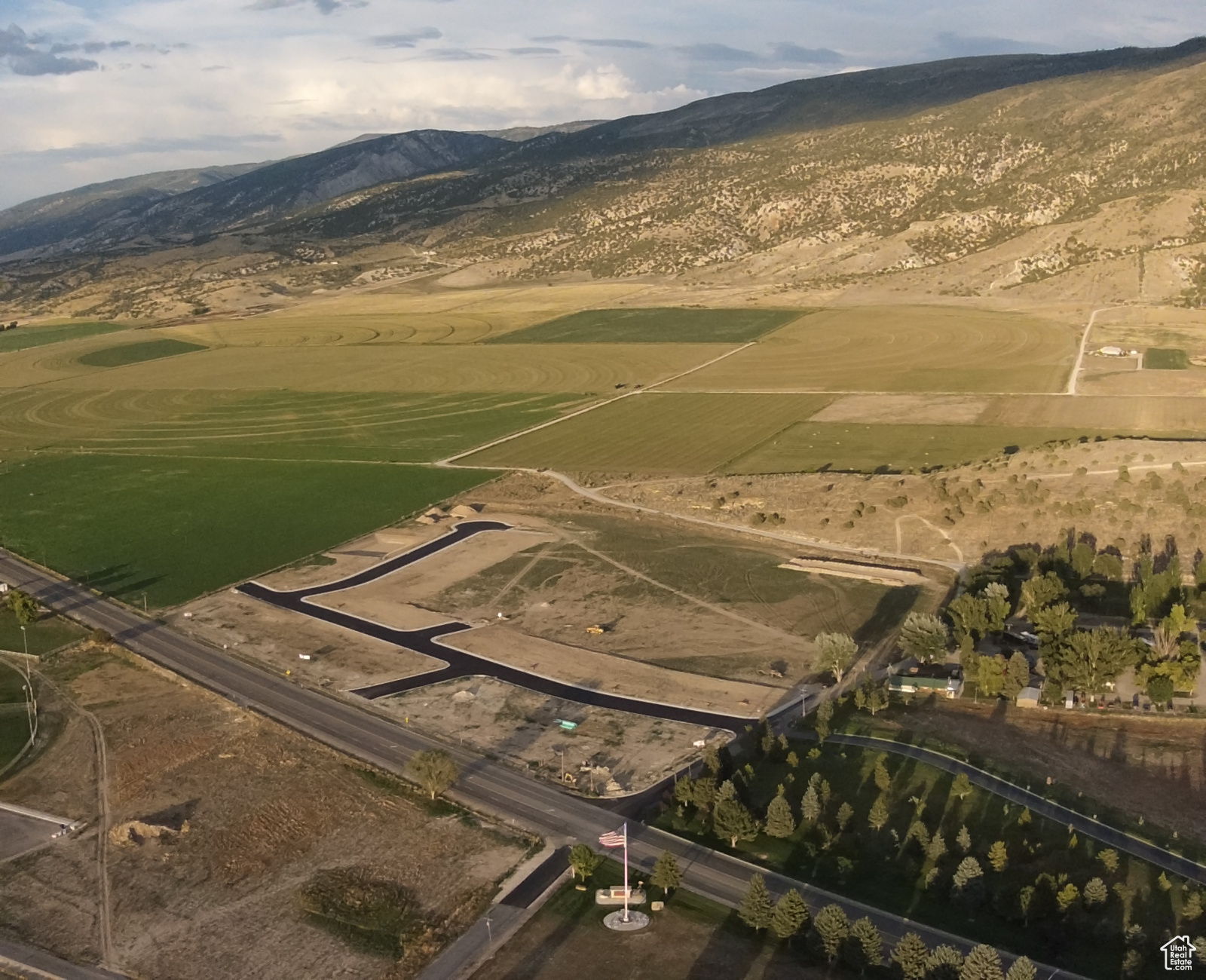 Birds eye view of property with a mountain view and a rural view