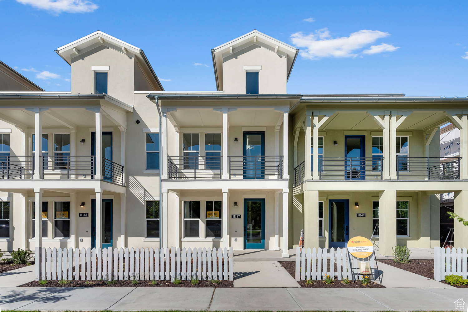 Exterior space featuring a balcony and covered porch