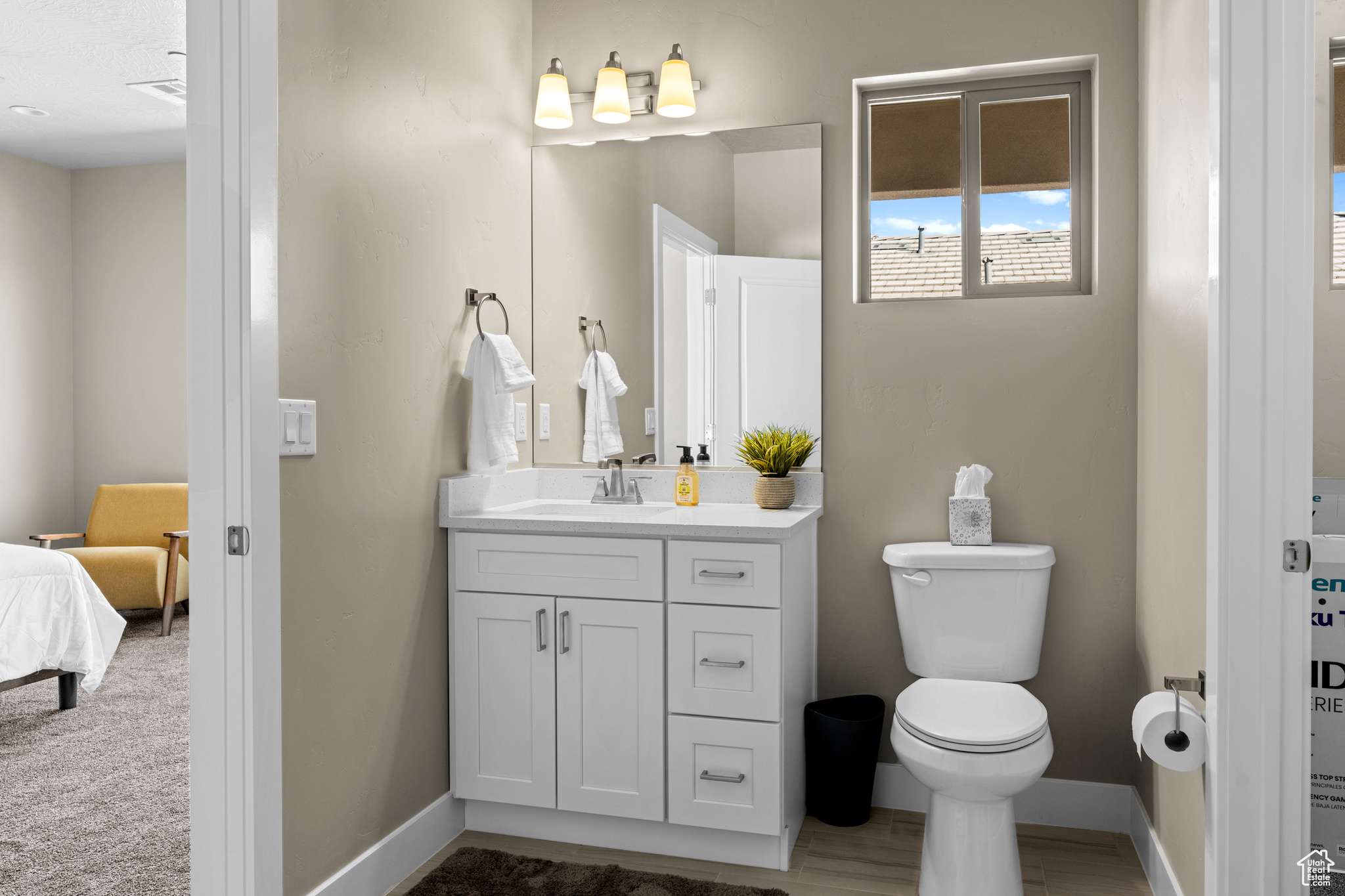 Bathroom featuring toilet and vanity