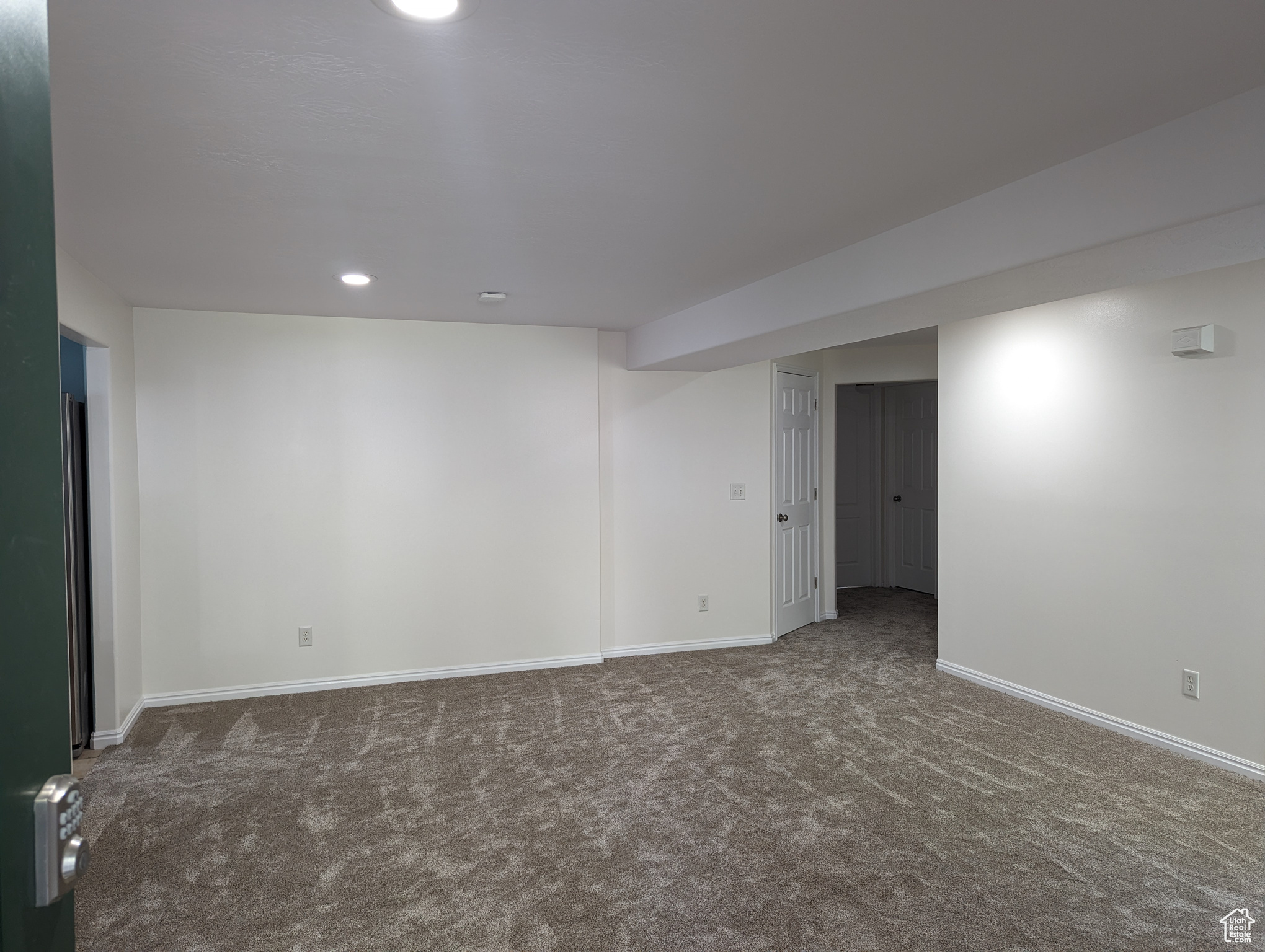 Great room with dark colored carpet