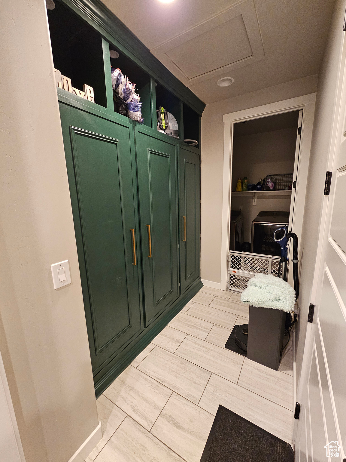 Custom Cabinetry w/ garage door entry and walkway to laundry room