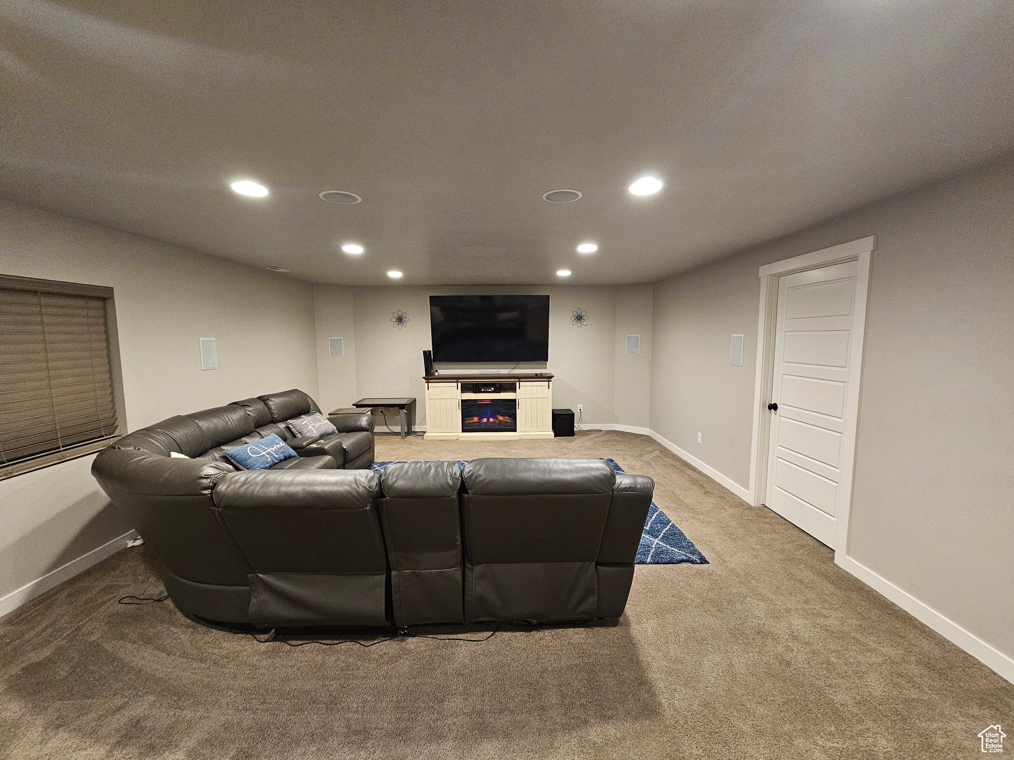 Family room with the door to the storage that can be doubled as an office
