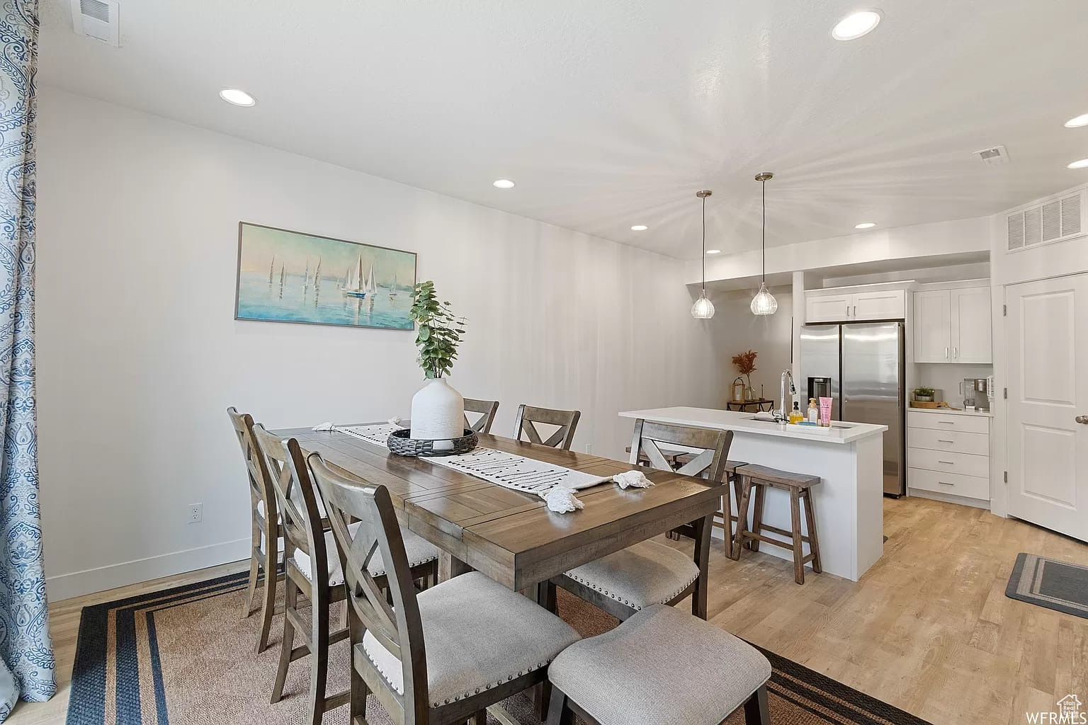 Dining space featuring light wood-type flooring