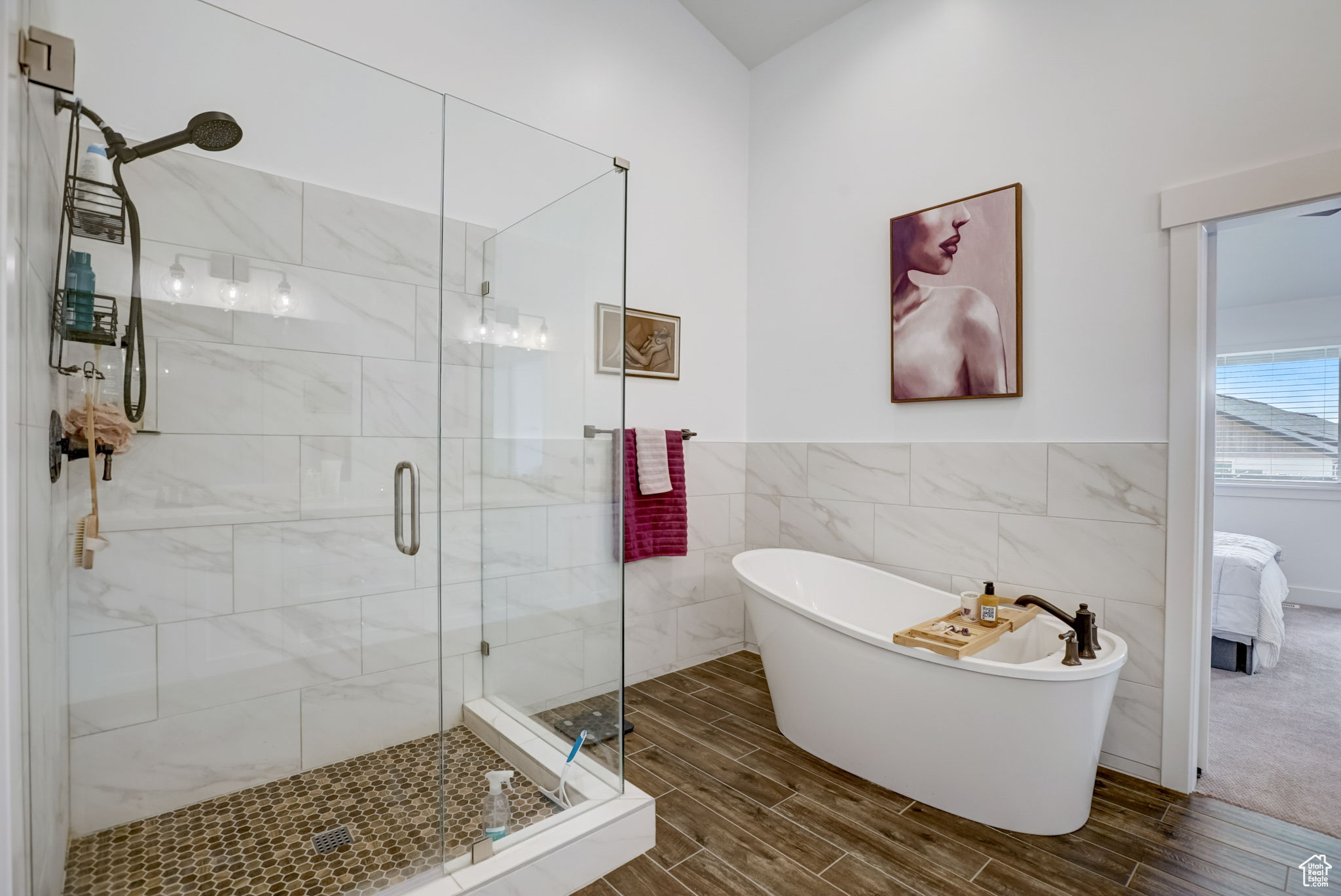 Owner's bathroom with tile walls and plus walk in shower
