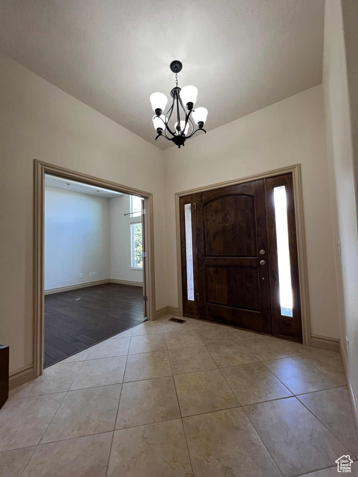 Foyer featuring a chandelier and tile flooring and Den/Office
