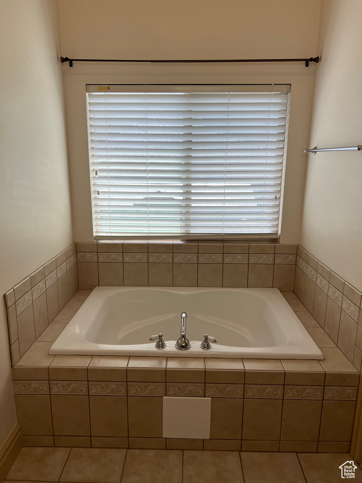 Master Bathroom Garden Tub with tile flooring and tiled bath