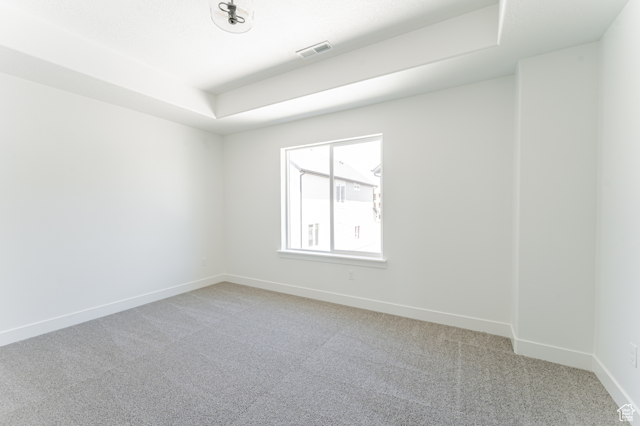 Empty room featuring carpet