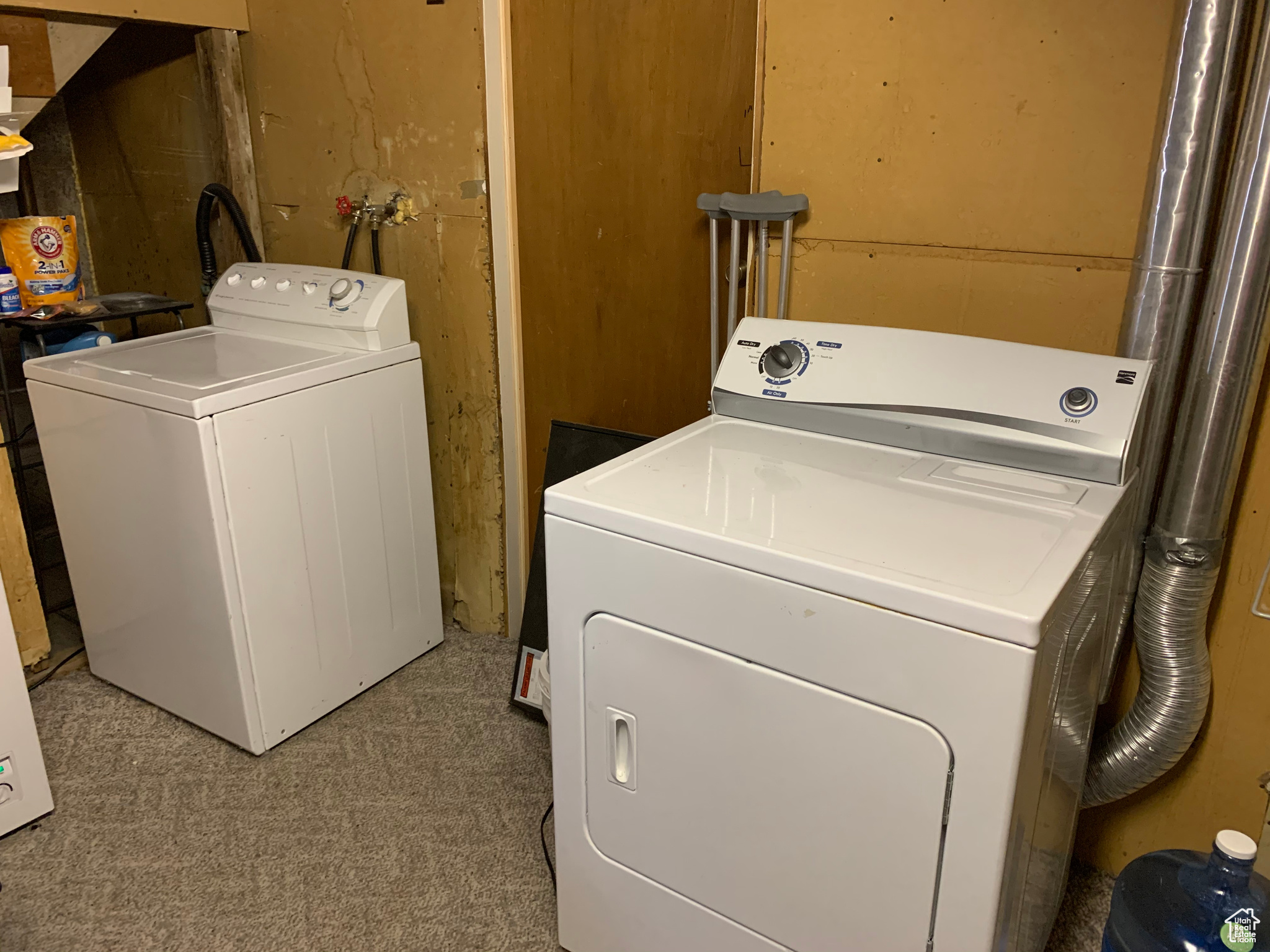 Clothes washing area featuring independent washer and dryer, carpet, and washer hookup