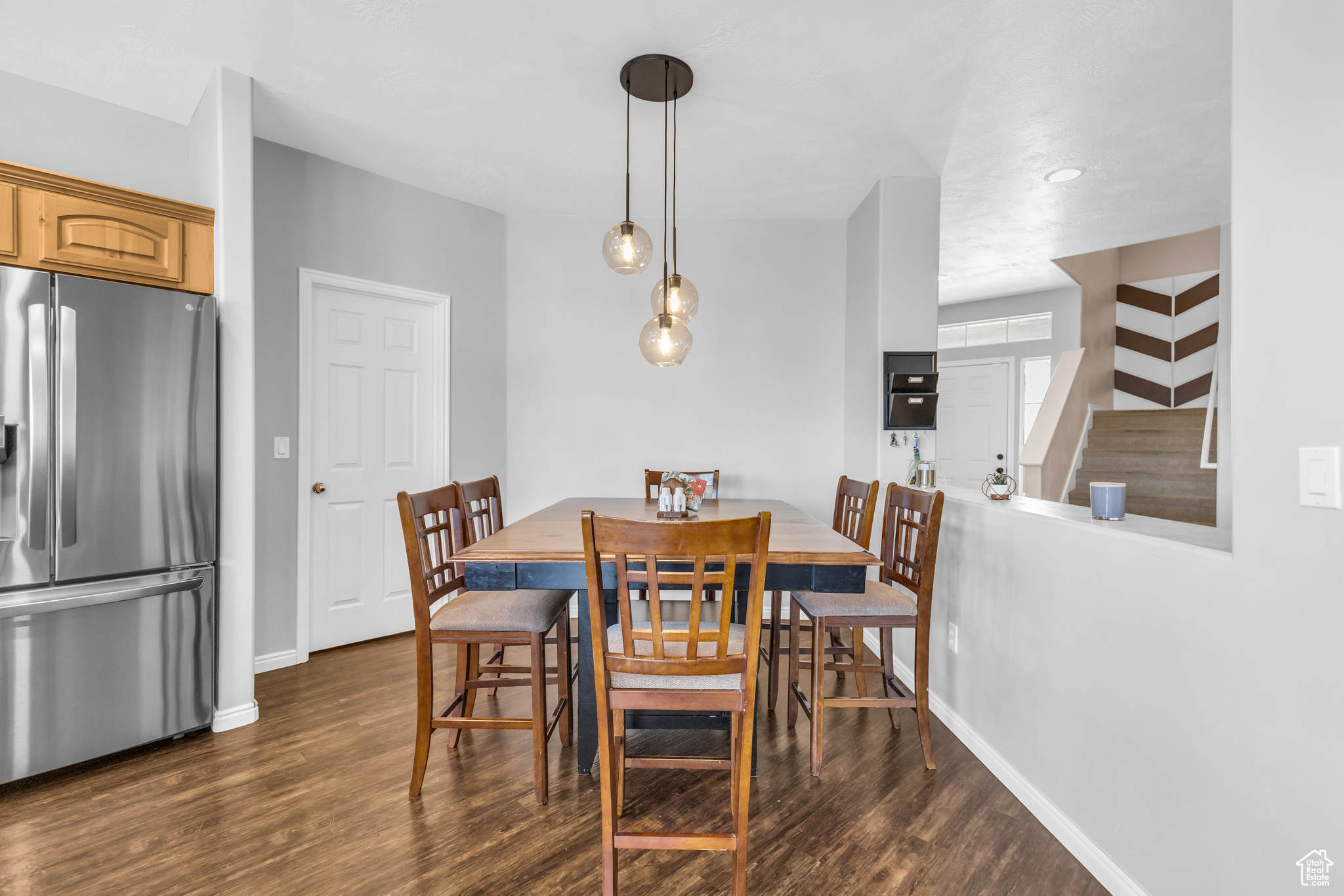 Dining space featuring dark wood-type flooring