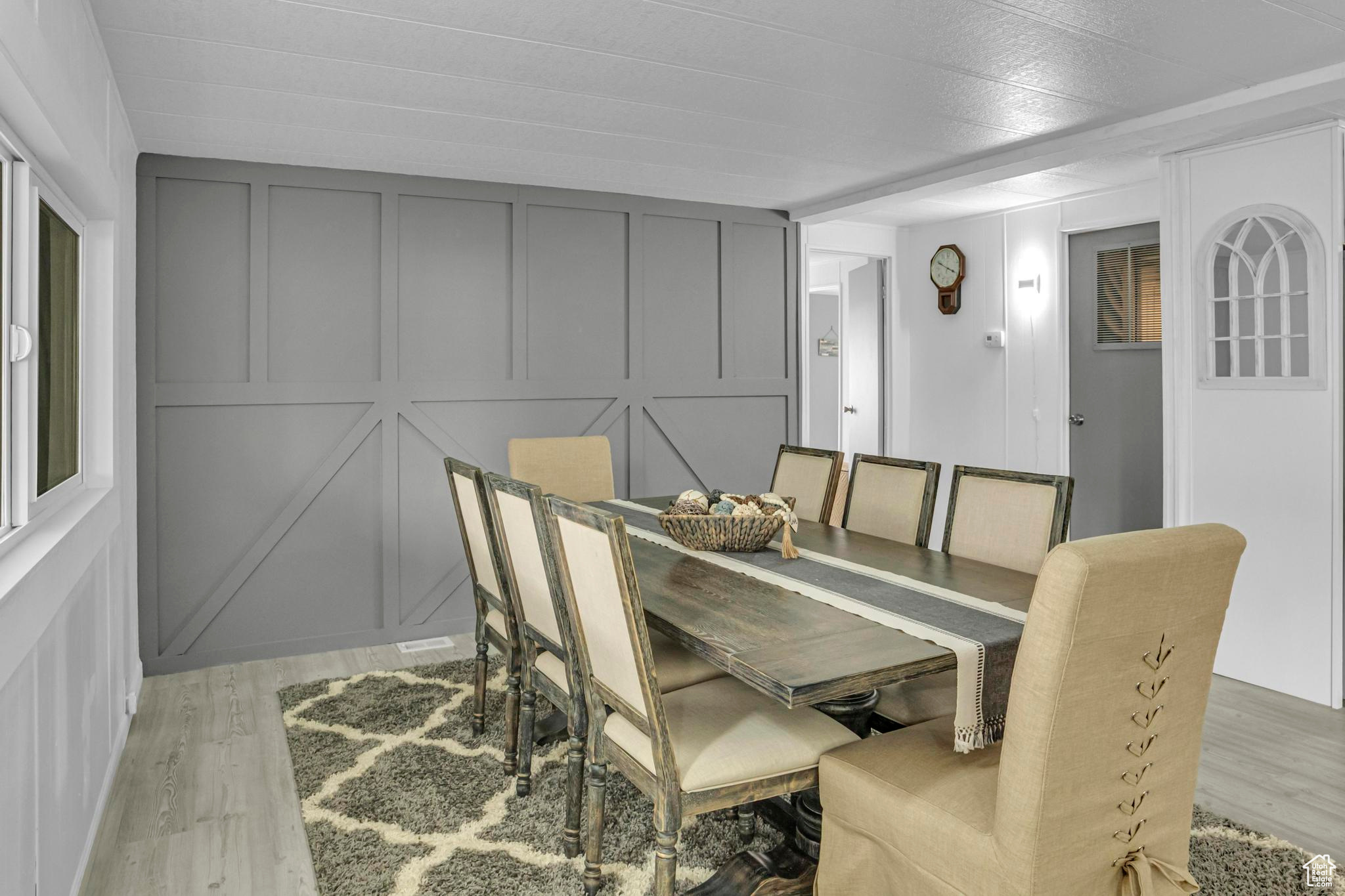 Dining room with light hardwood / wood-style floors