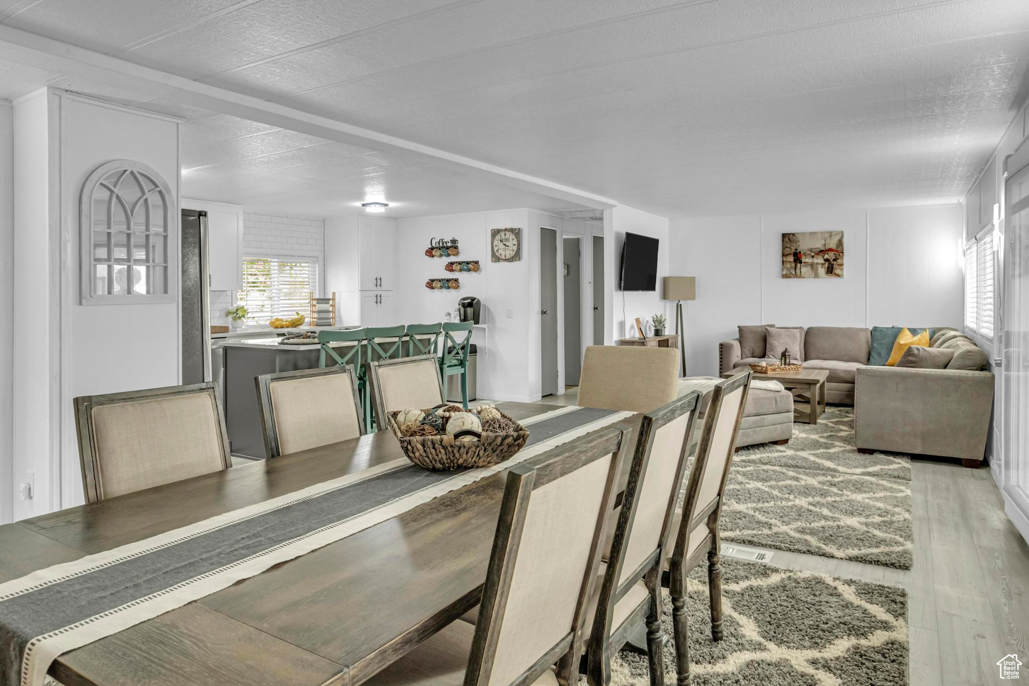 Dining space with light hardwood / wood-style flooring