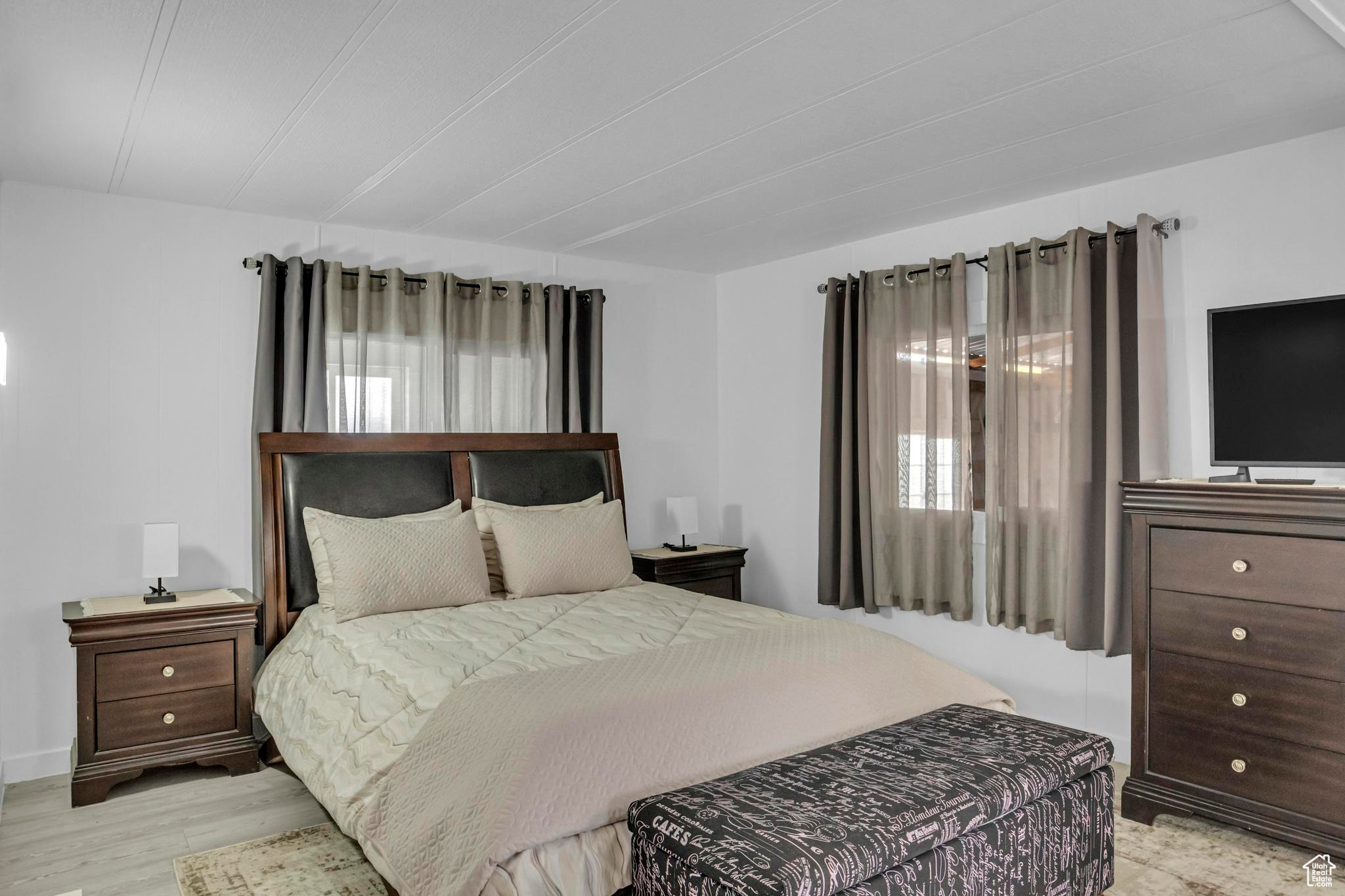 Bedroom with light hardwood / wood-style floors