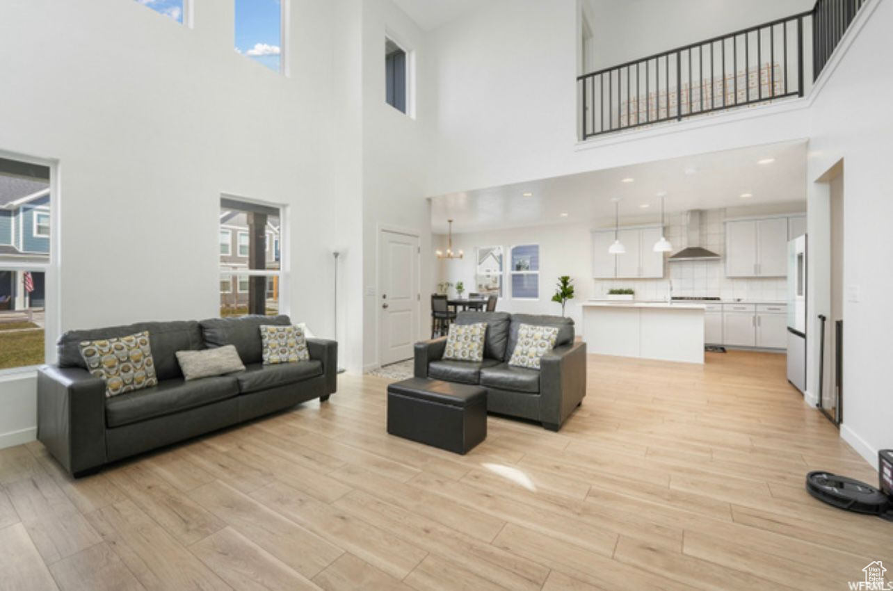 Living room featuring plenty of natural light and light hardwood / wood-style floors