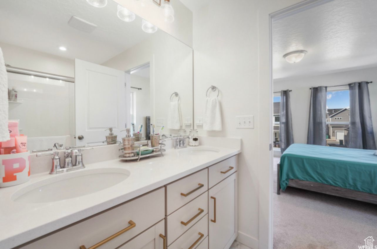 Bathroom with dual sinks and oversized vanity