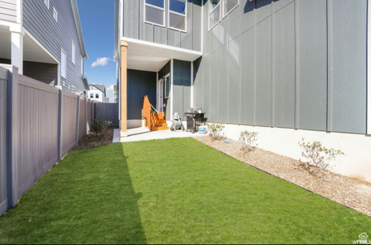 Exterior space with a lawn