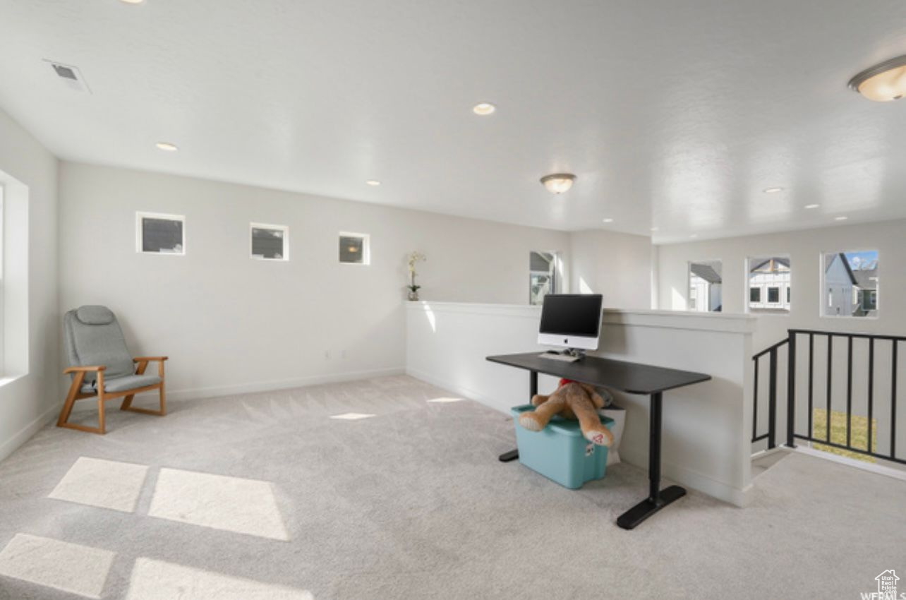 Office space with light colored carpet