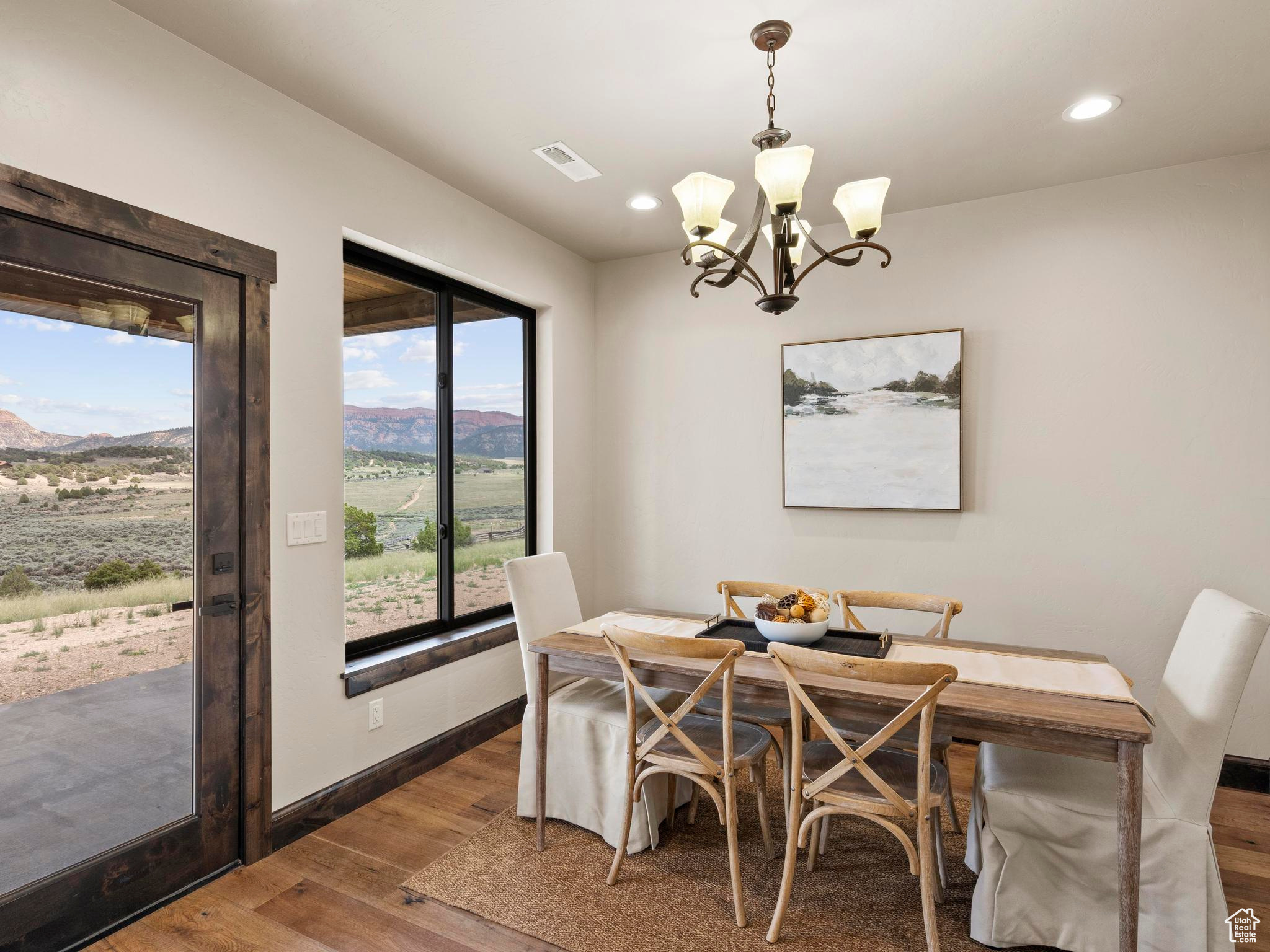 Dining space with views and access to expansive covered patio