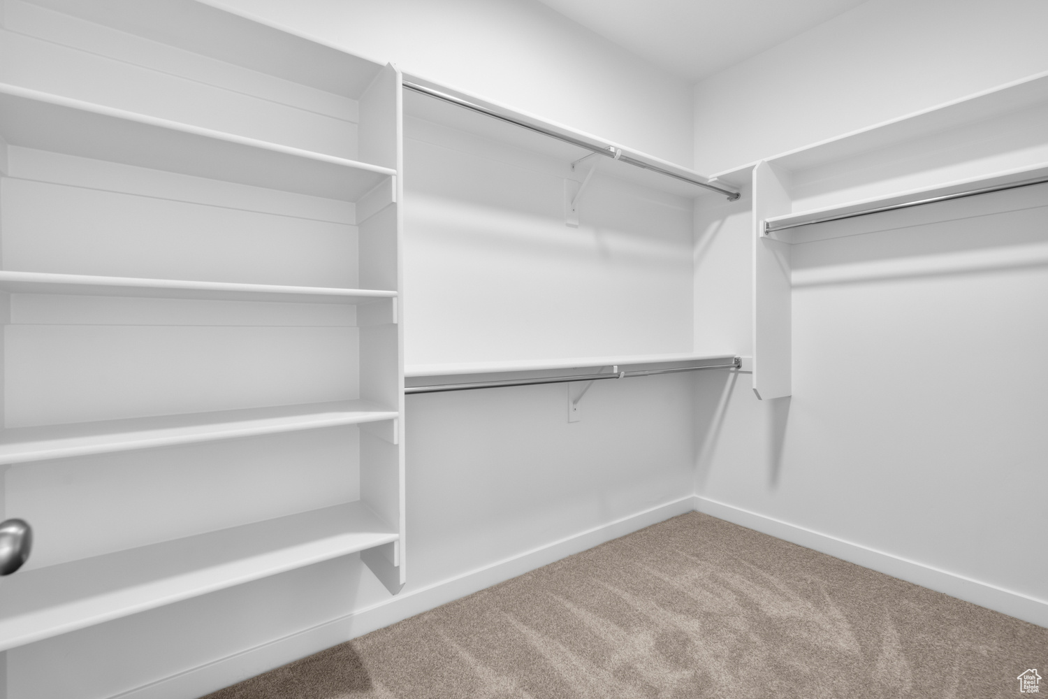 Spacious closet with carpet flooring