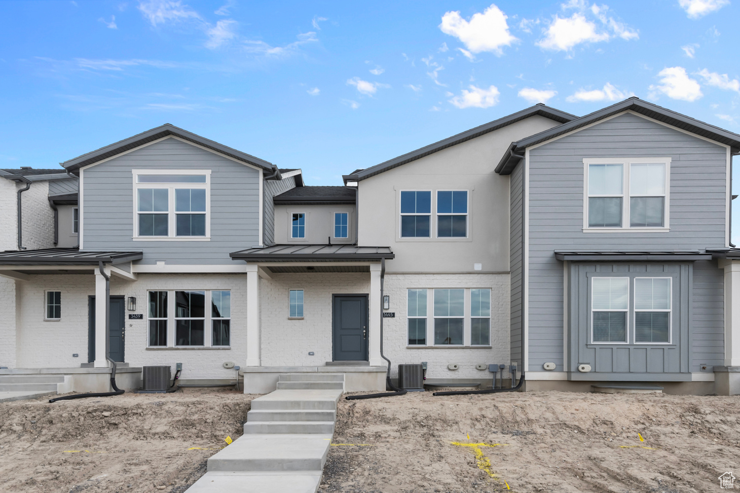 View of front of home with central air condition unit