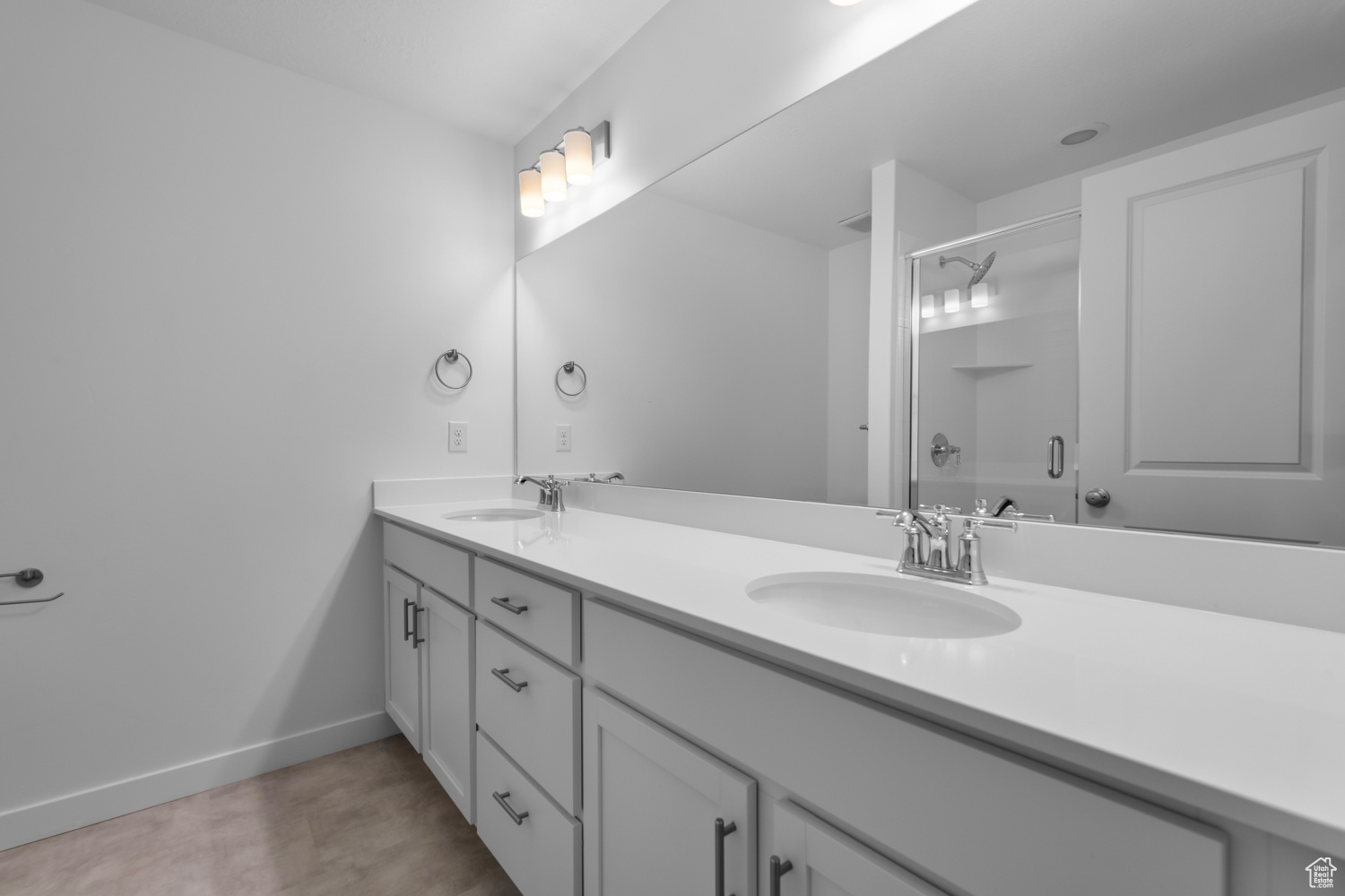 Bathroom featuring dual bowl vanity