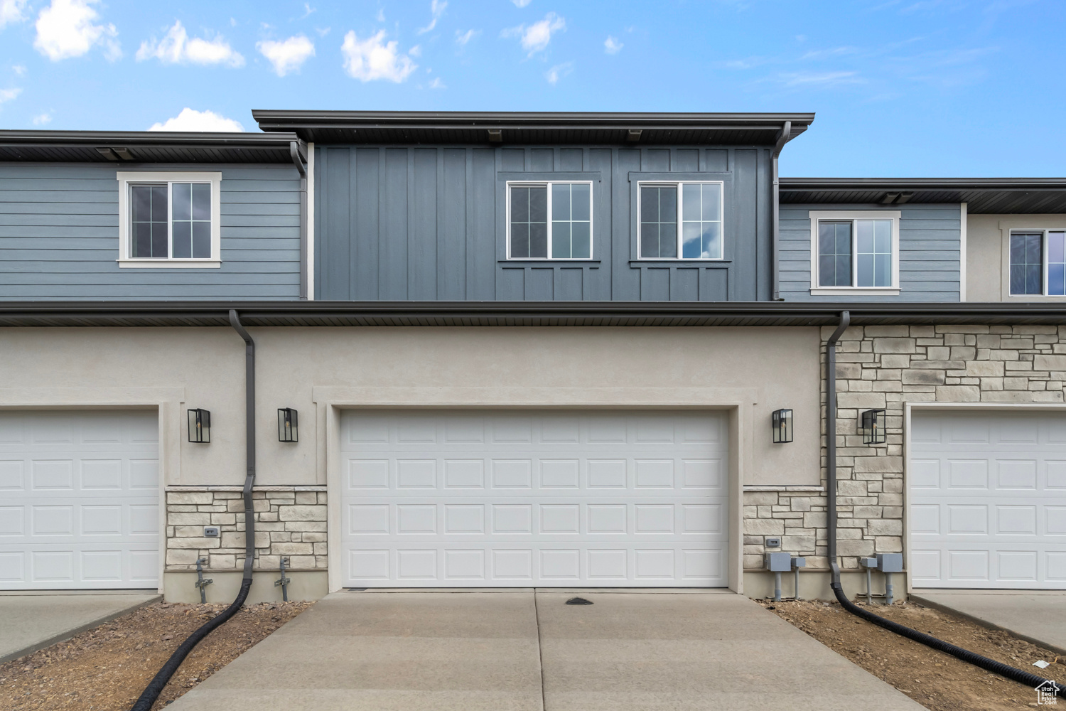 View of front facade featuring a garage