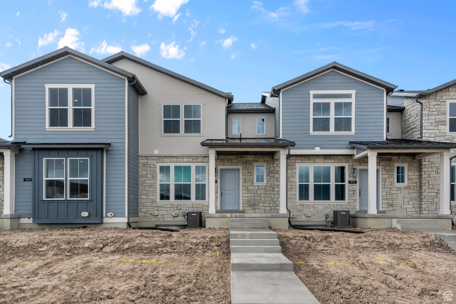 View of front of property with central AC unit