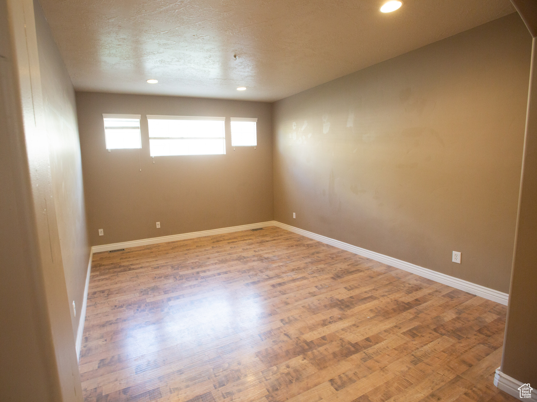 Spare room with wood-type flooring