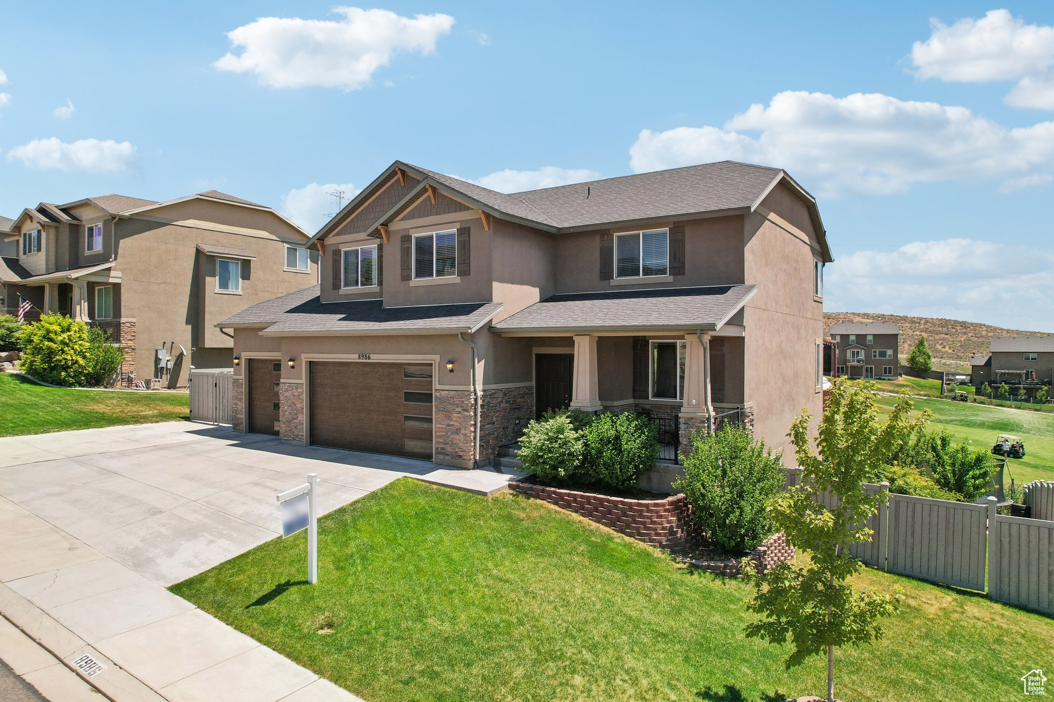 View of front of house featuring a front yard and a 3 garage