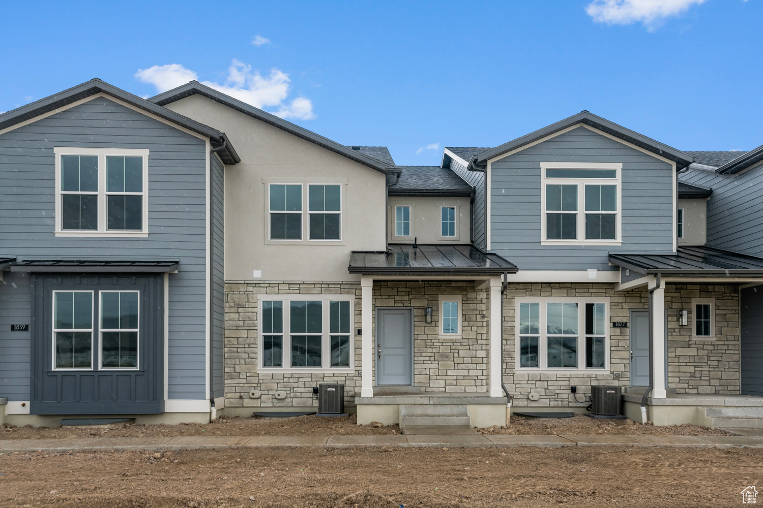 View of front of house featuring central AC