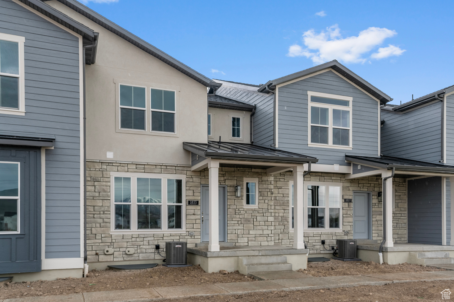 View of front of house featuring central AC unit