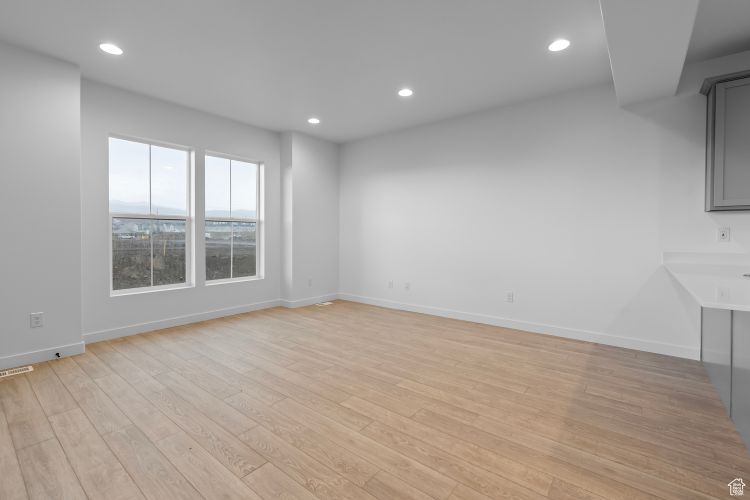 Spare room featuring light hardwood / wood-style floors