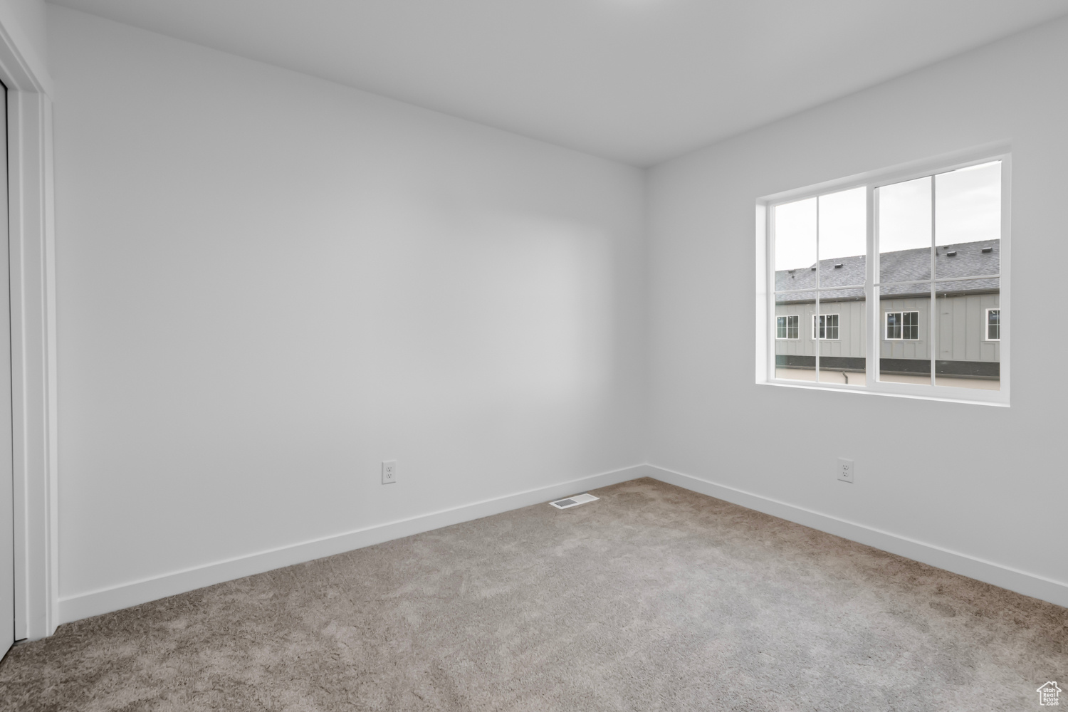 Empty room featuring carpet