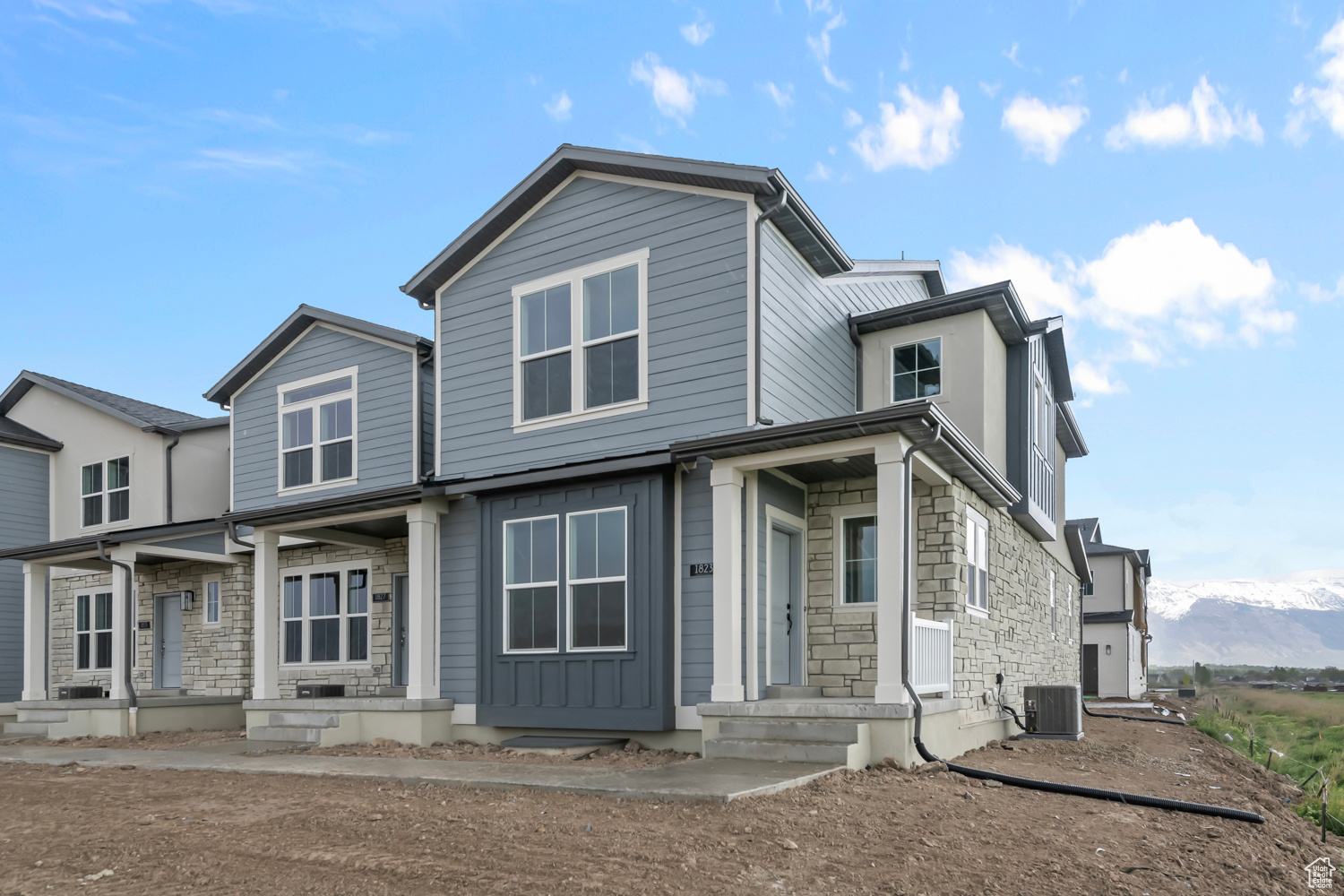 View of front of house featuring central AC unit