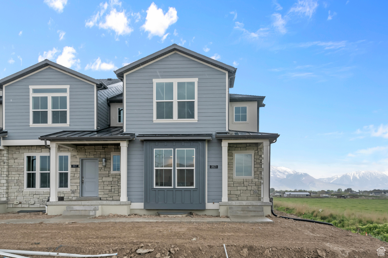 View of front of property with a mountain view