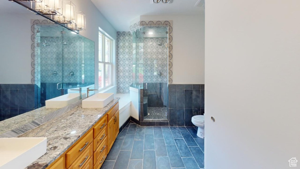 Primary bathroom with a massive 2-sink countertop and separate tub and shower