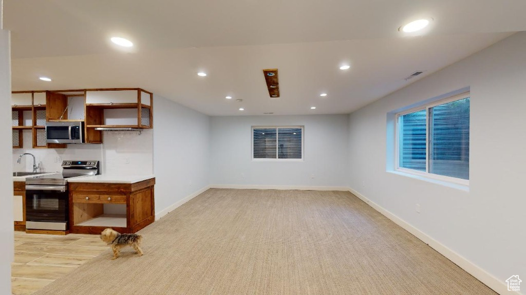 View of the basement family room and kitchen area