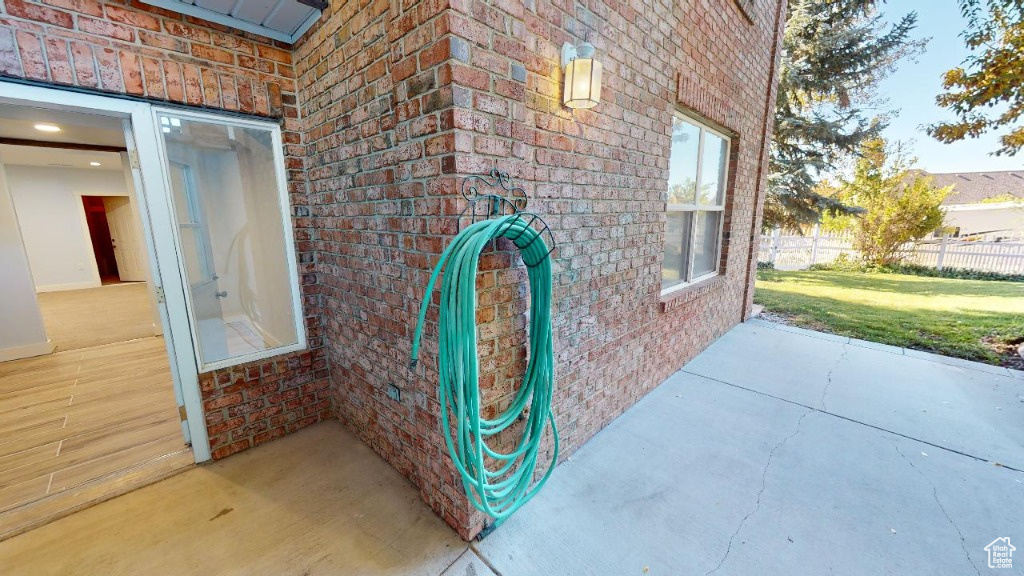 View of the rear patio and entrance into the basement