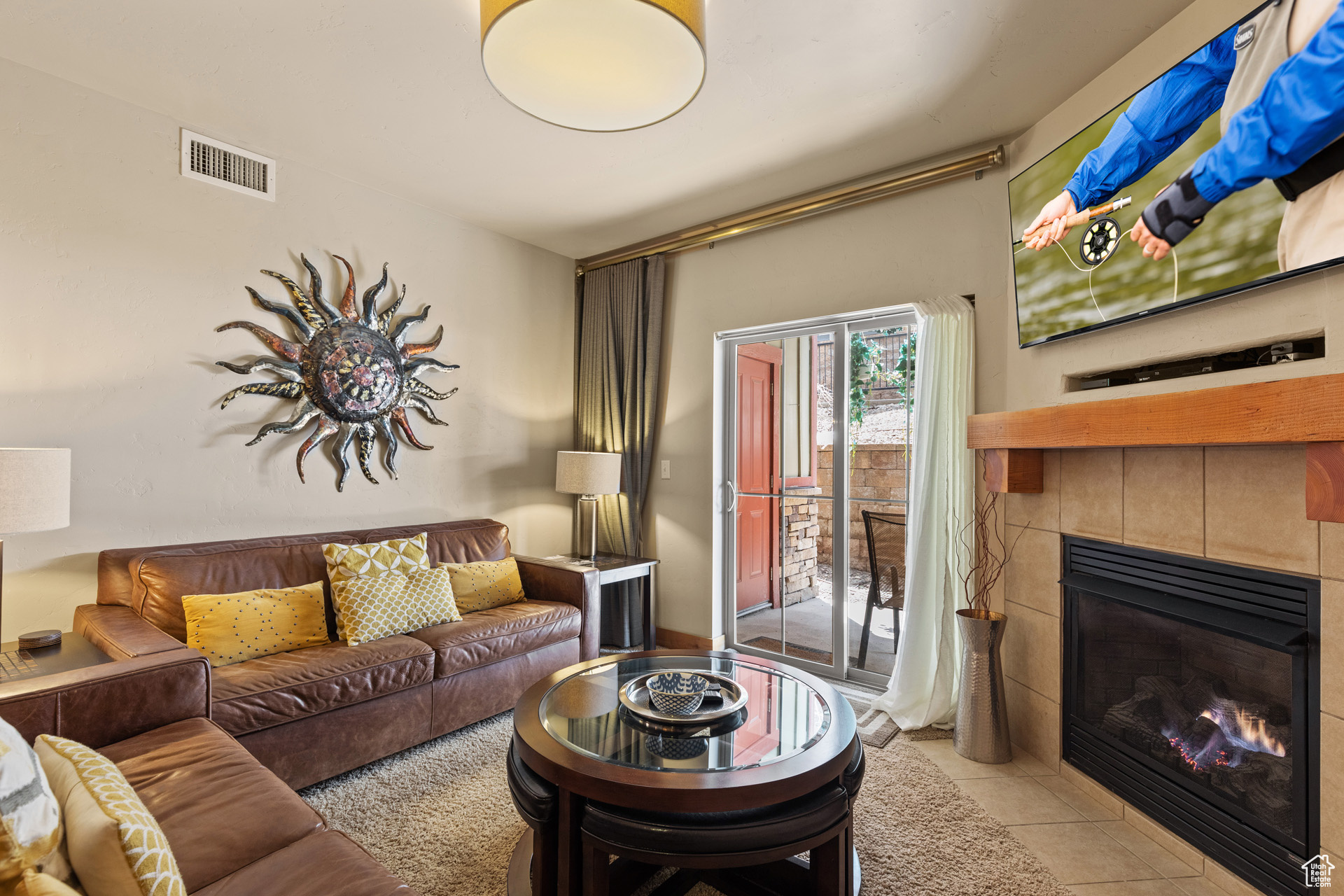 Tiled living room featuring a fireplace