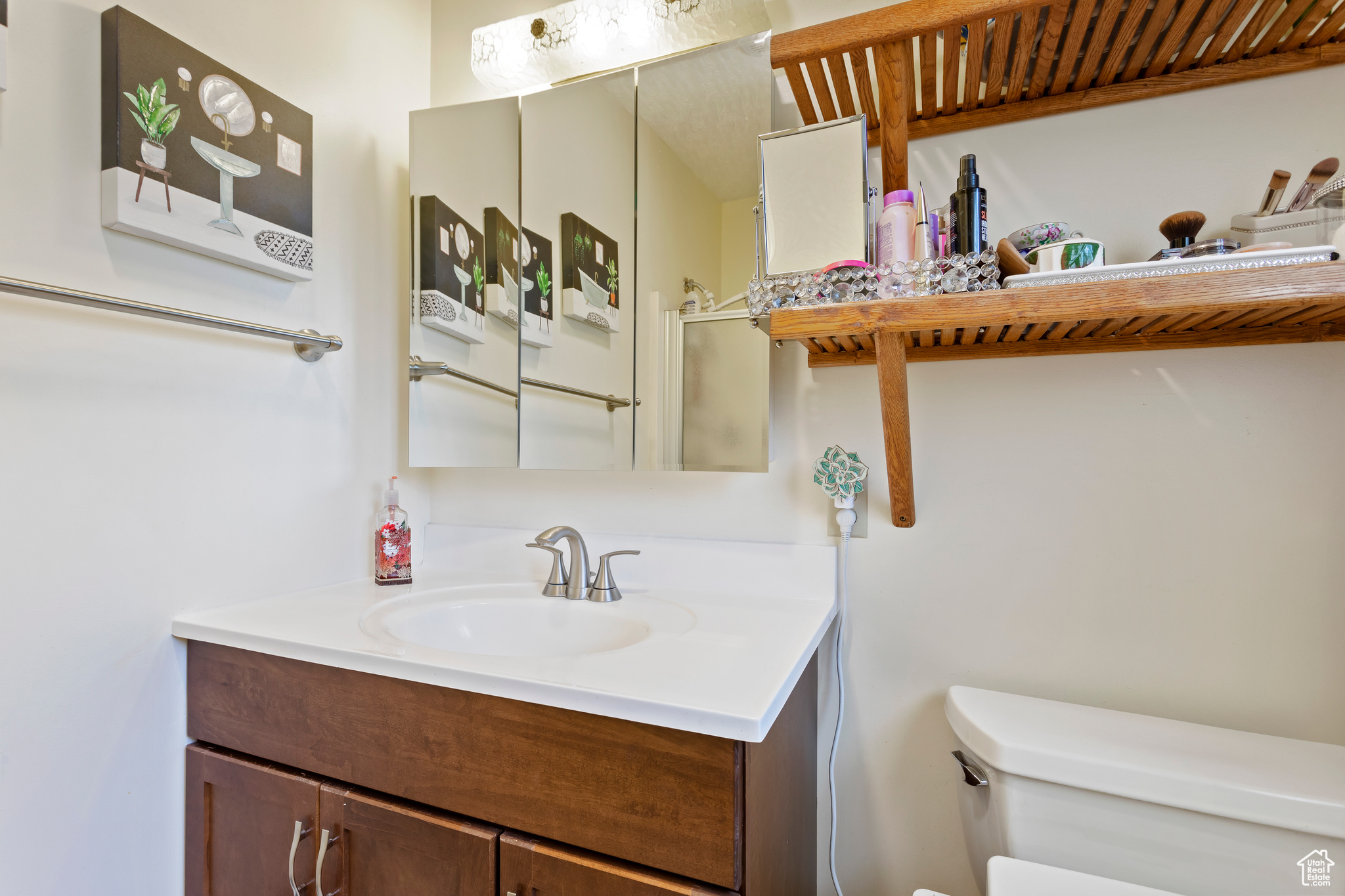 Bathroom featuring toilet and large vanity