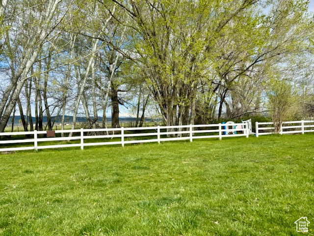 View of yard with a rural view