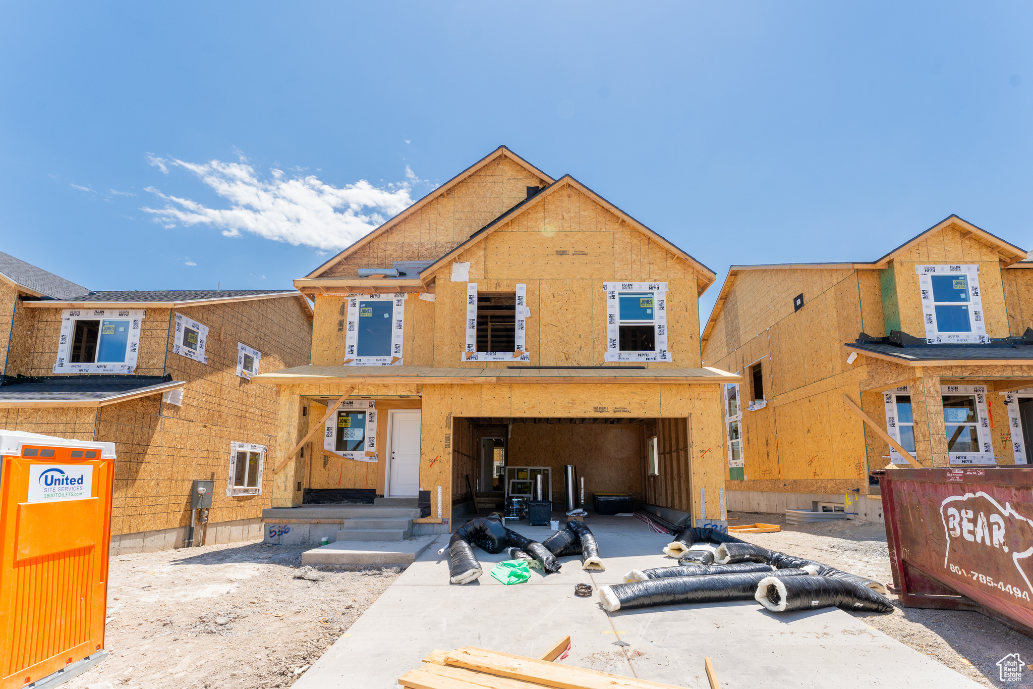 Property under construction with a garage