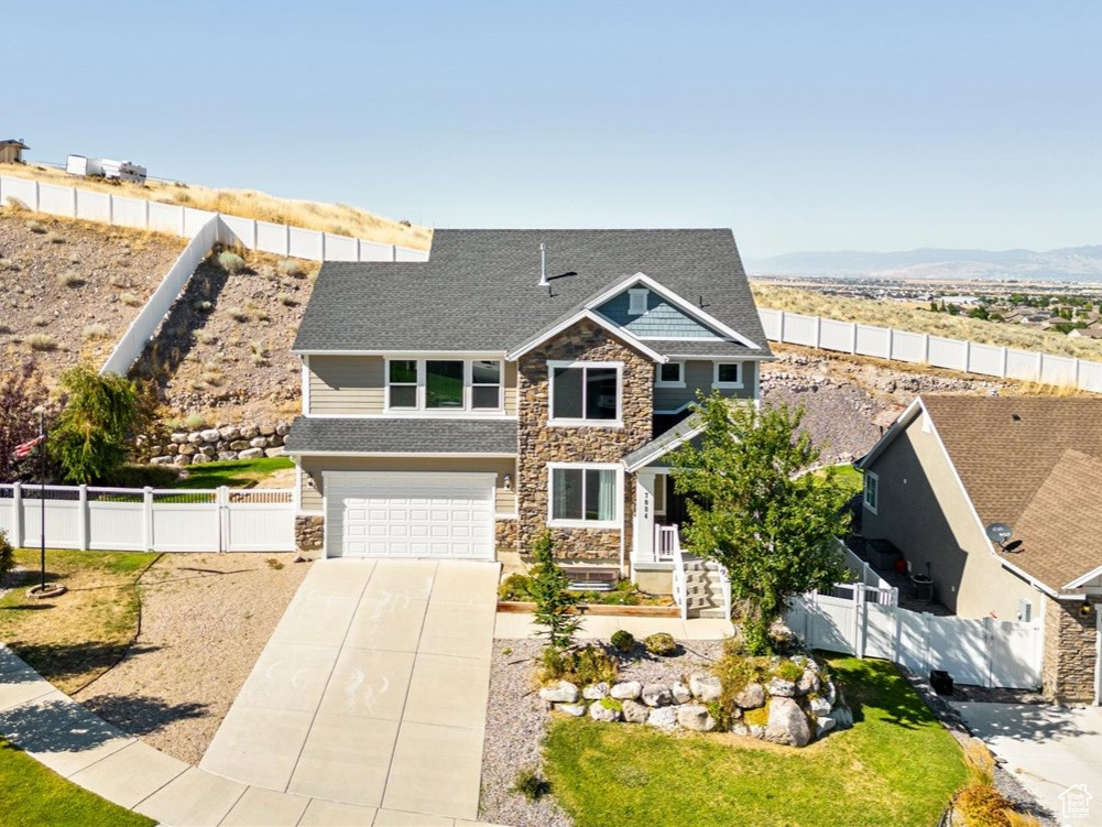 View of front of property featuring a garage