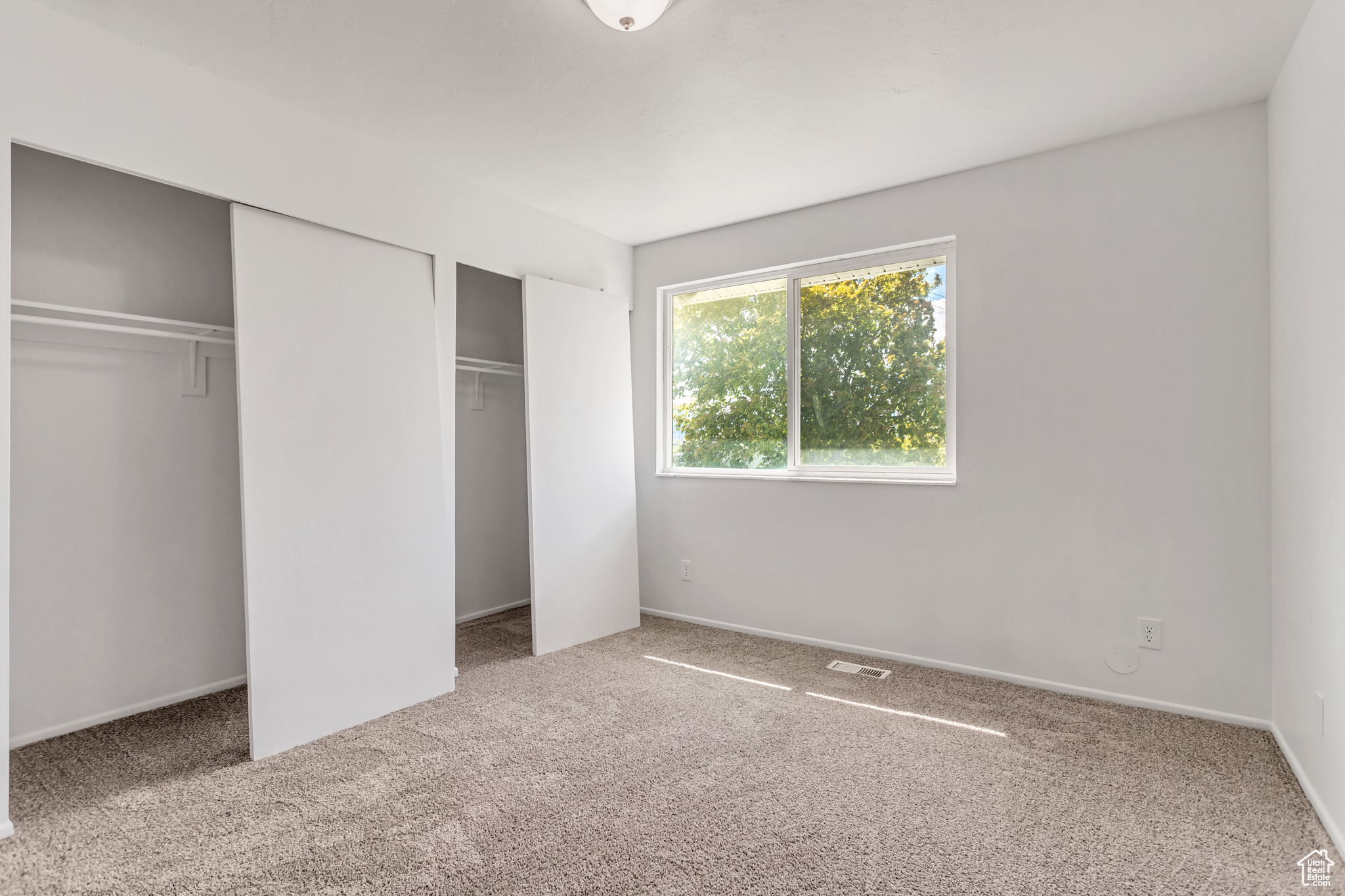 Unfurnished bedroom featuring carpet