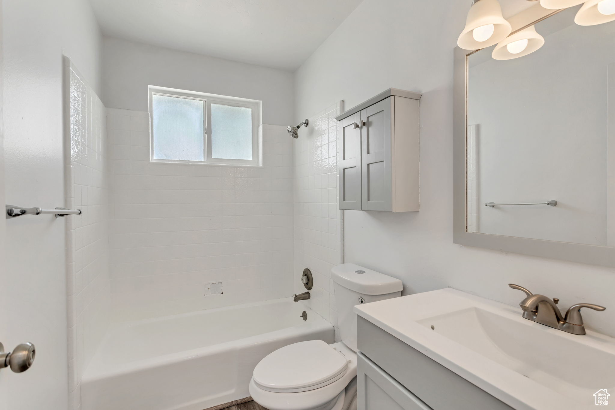 Full bathroom with shower / bathtub combination, vanity, and toilet