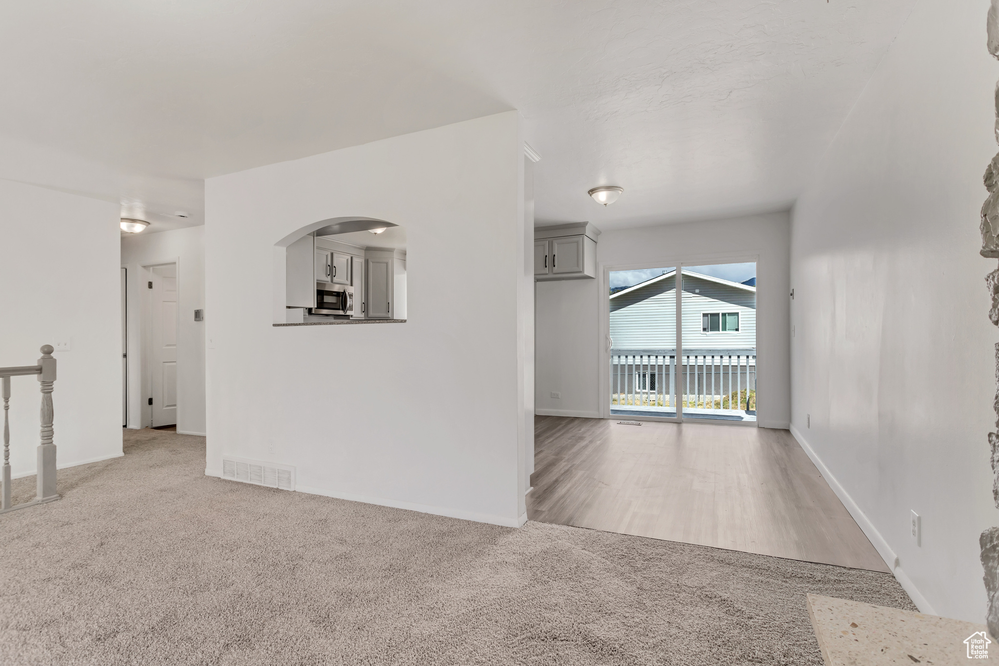 Empty room with carpet floors