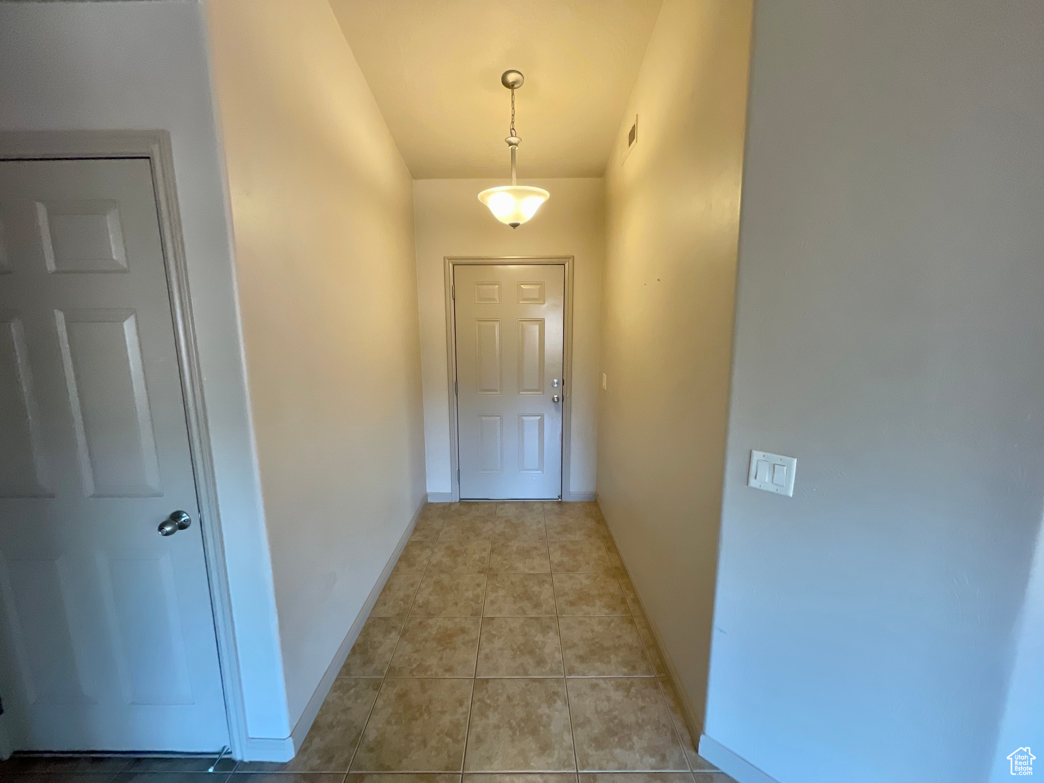 Interior space featuring light tile patterned floors