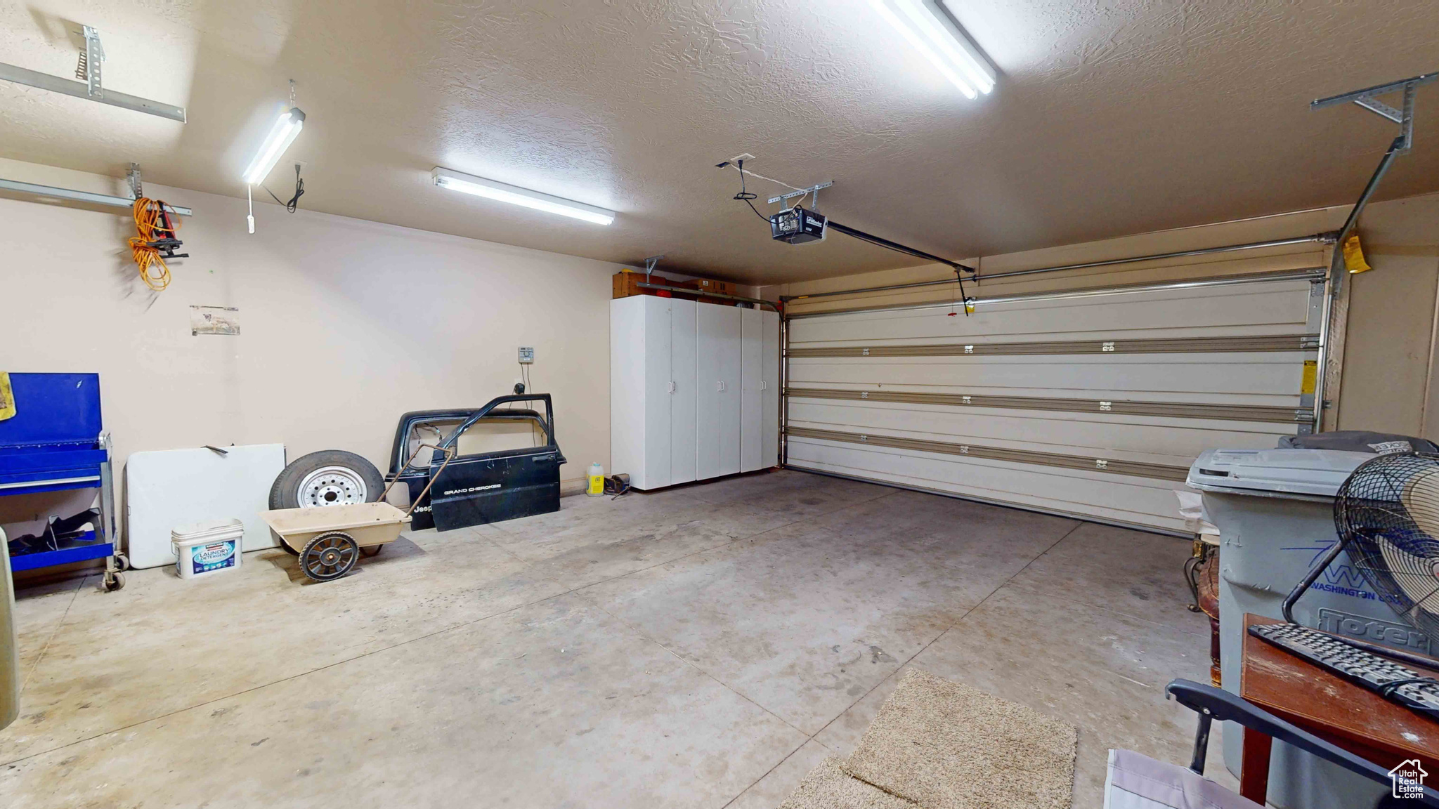 Garage featuring a garage door opener