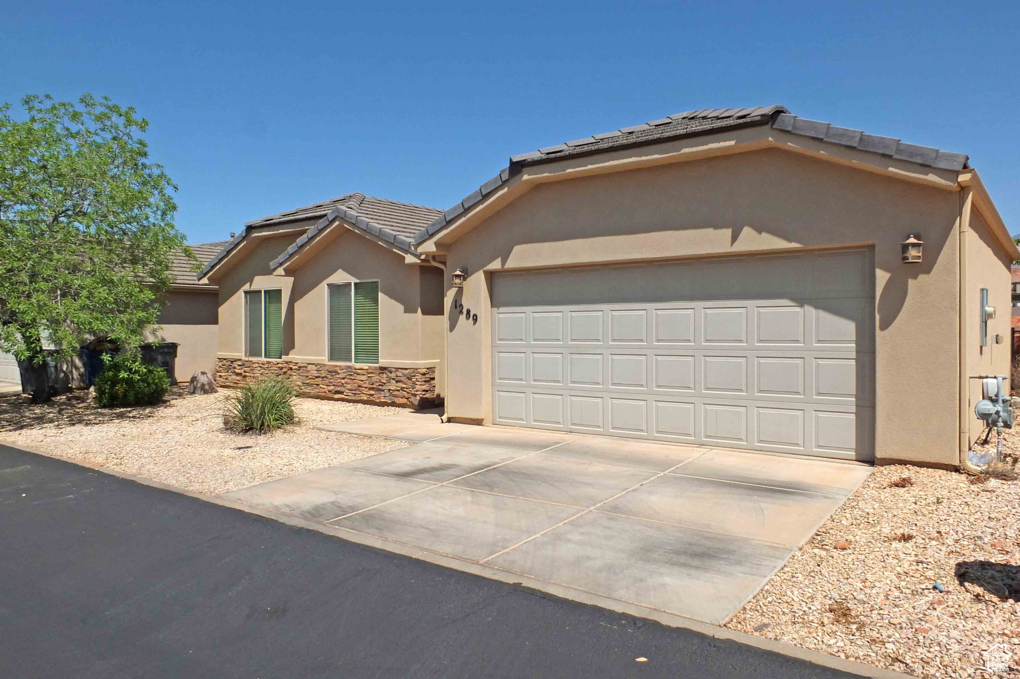 View of front of home featuring a garage